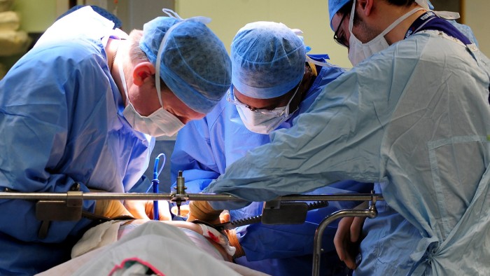 Medics seen working during an operation