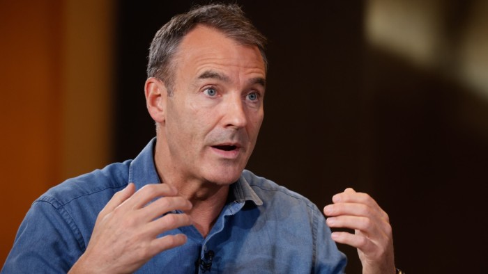 Bernard Looney raising his hands during an interview in February 2022