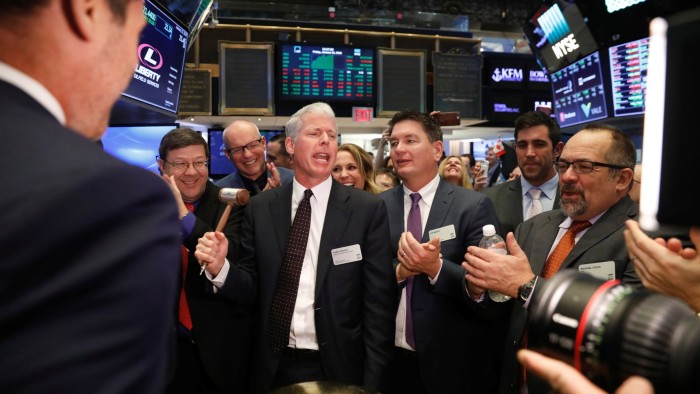 Liberty Energy CEO Chris Wright rings a ceremonial bell to celebrate the company’s IPO on the New York Stock Exchange in 2018