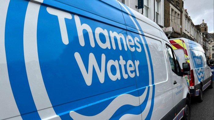 Thames Water vans are parked on a road