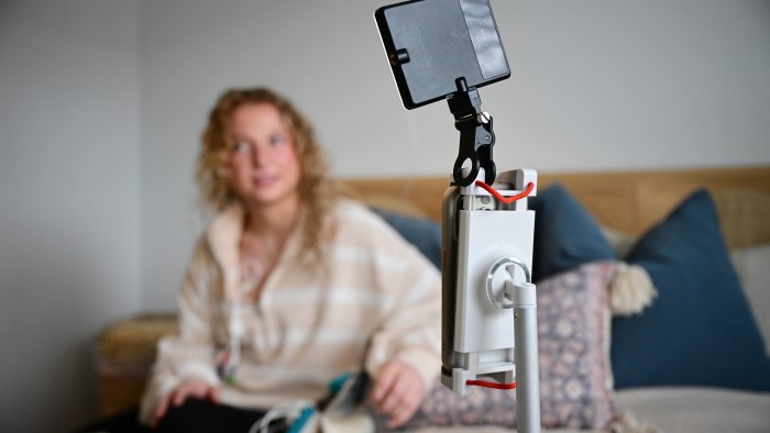 A woman filming a video of herself