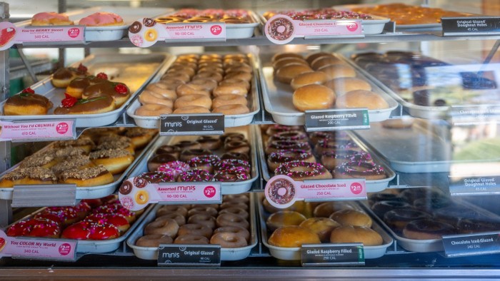 Doughnuts are displayed for sale at a Krispy Kreme
