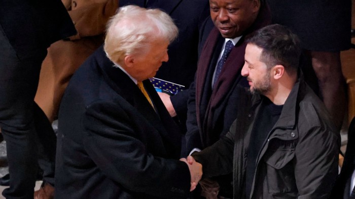 Donald Trump shakes hands with Volodymyr Zelenskyy