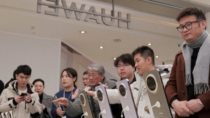 Huawei phones are displayed at a flagship store in Beihing