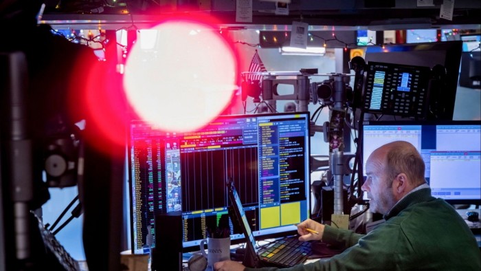 A trader works on the floor of the New York Stock Exchange