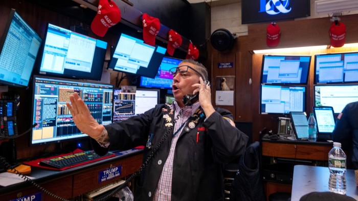Traders work on the New York Stock Exchange floor