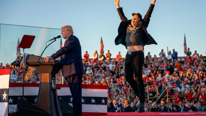Elon Musk jumps on stage as he joins Donald Trump during a campaign rally in Butler, Pennsylvania