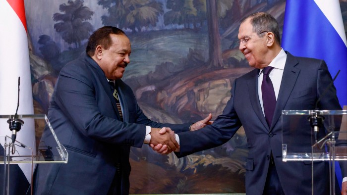 Sergei Lavrov and his Sudanese counterpart Ali Yousuf Al-Sharif shake hands