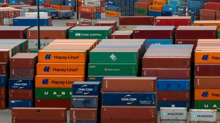 Shipping containers to be transported at the Port of Seattle in Seattle, Washington, US