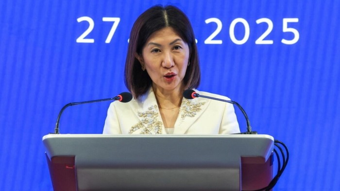 Bonnie Chan speaks at a podium during a news conference
