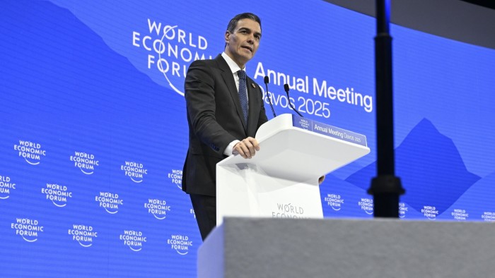 Spanish Prime Minister Pedro Sanchez stands at the podium to deliver a speech at the Davos summit in Switzerland