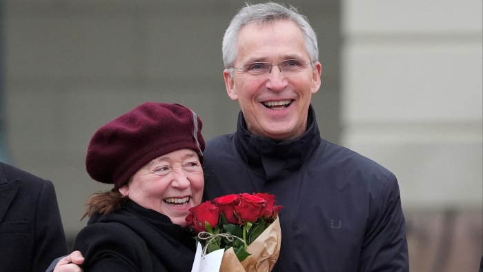 Former Secretary General of NATO Jens Stoltenberg, set to become Norway’s new finance minister, embraces his wife Ingrid Schulerud on the day Norway’s Prime Minister Jonas Gahr Store appoints a new government