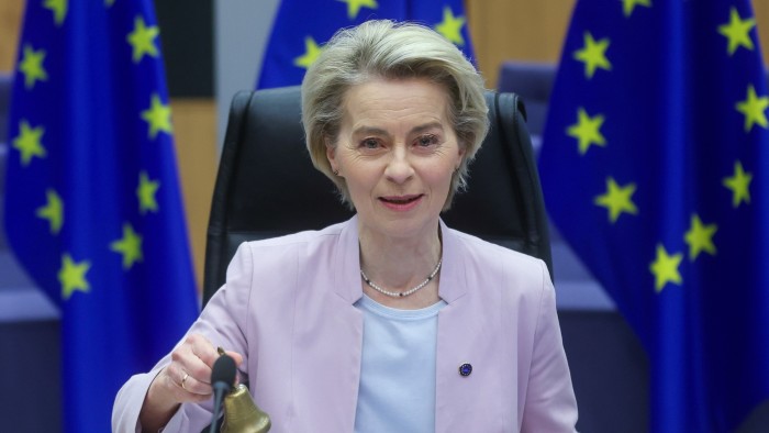 European Commission President Ursula von der Leyen rings the bell at the start of a meeting of the College of Commissioners in Brussels