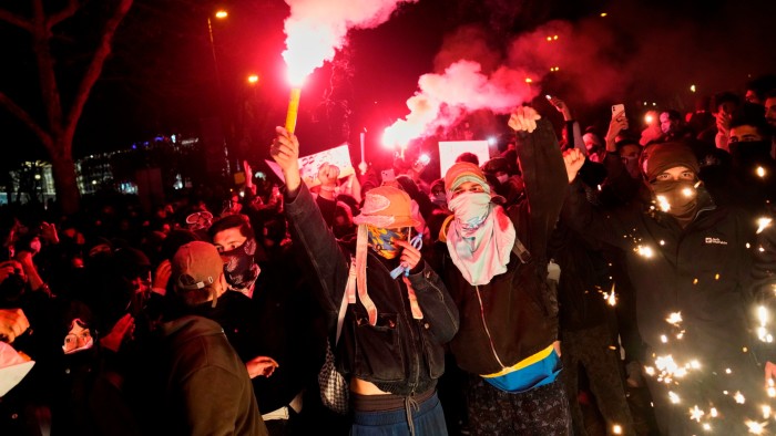 People light flares as they protest against the arrest of Istanbul’s mayor Ekrem İmamoğlu, in Istanbul on Friday