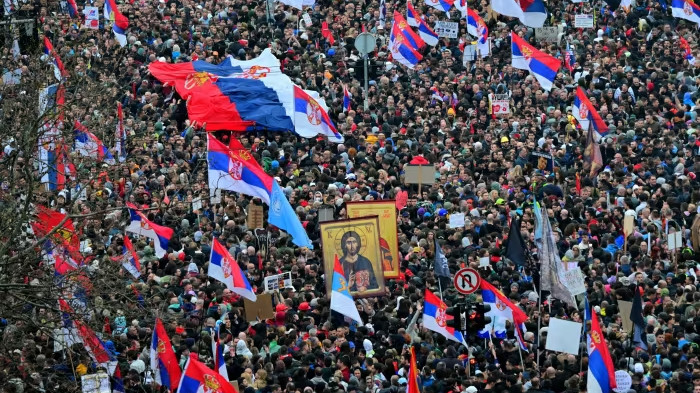 Protestors on the streets of Slovakia, waving the national flag.