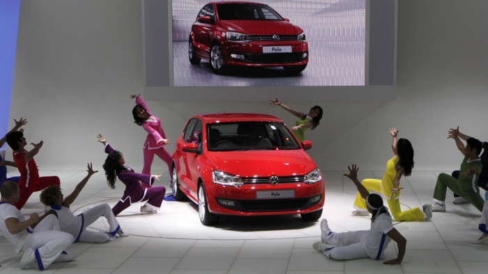 Indian dancers perform at the launch of the new Volkswagen Polo at the 10th Auto Expo in New Delhi