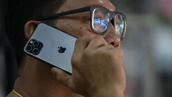 A man uses an iPhone