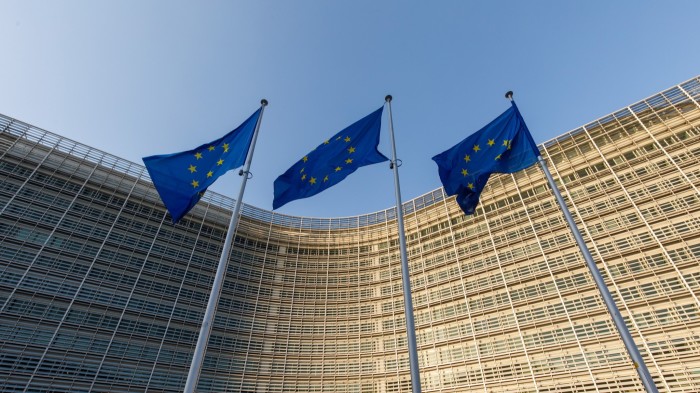 Flags of the European Union (EU) fly from flagpoles outside offices of the European Commission