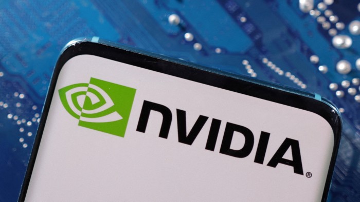 Nvidia logo on a smartphone in front of a computer motherboard