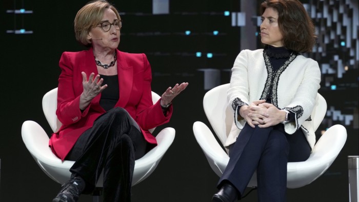 Vodafone CEO Margherita Della Valle (L) and Orange CEO Christel Heydemann attend a session on the first day of the Mobile World Congress in Barcelona, Spain