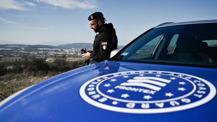 An officer from the EU’s Frontex border agency carries out a patrol on the Bulgaria-Serbia border