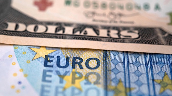 A 10 dollar bill next to a 20 euro bill