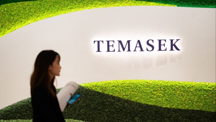 Signage for Temasek Holdings Pte during a news conference in Singapore