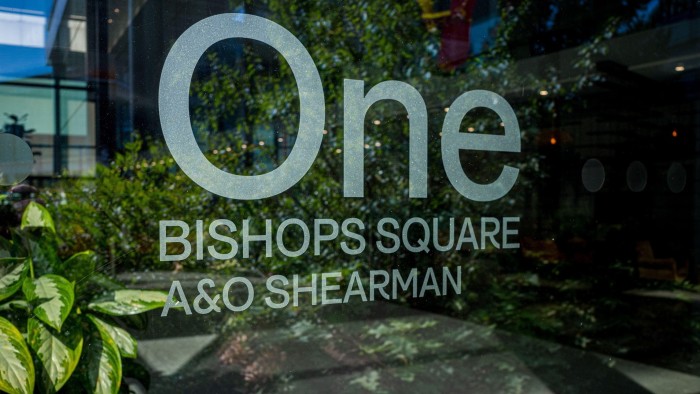 A glass window displays the words "One Bishop's Square A&O Shearman" in a corporate font.