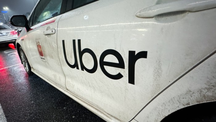 A car with an Uber logo