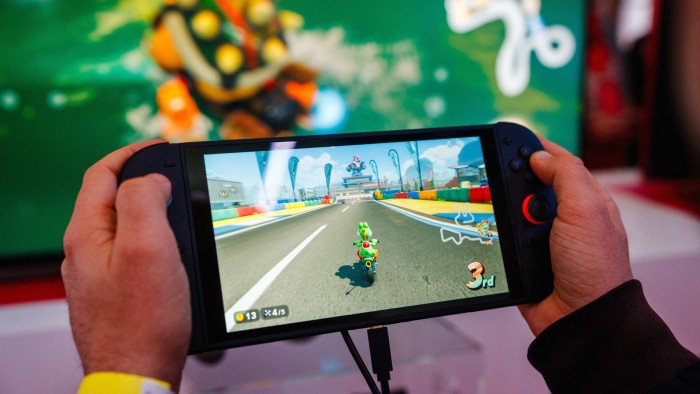 A Nintendo Switch 2 console with the game Mario Kart World on the display