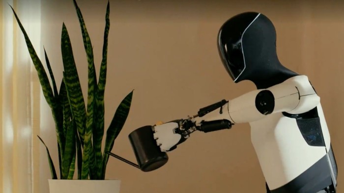Optimus humanoid robot watering a plant