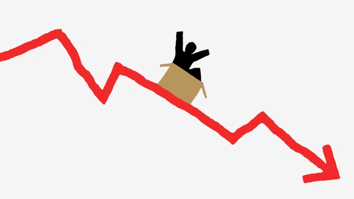 A person in a cardboard box slides down a red graph line