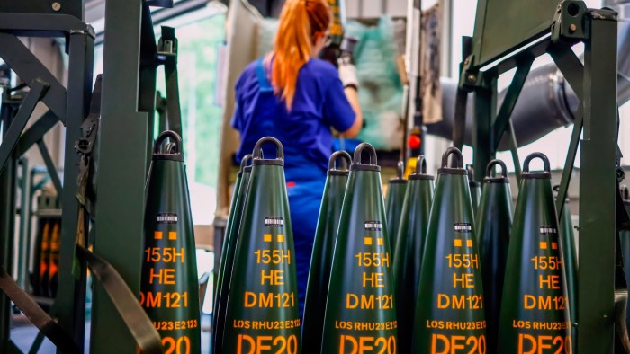 A Rheinmetall employee works in the production of 155mm artillery shells in Unterluess, Germany on June 6 2023