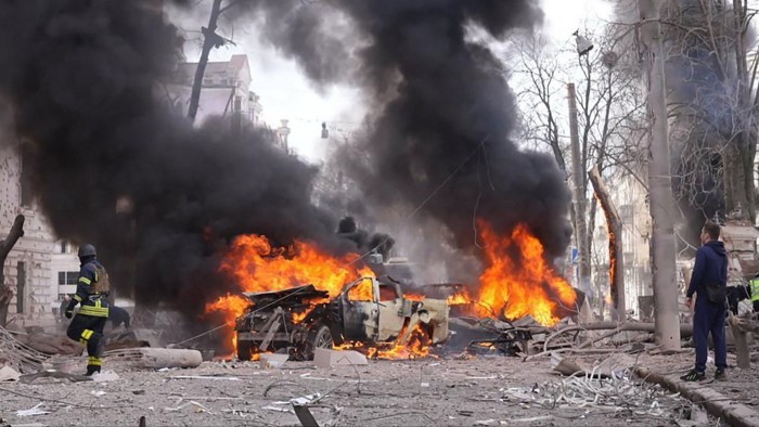 A Ukrainian rescuer working at the burning site of a Russian missile attack in Sumy, Ukraine on April 13