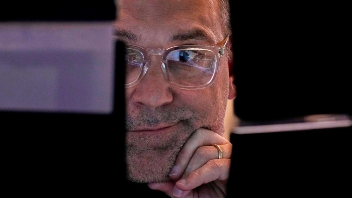 Specialist Anthony Matesic works on the floor of the New York Stock Exchange