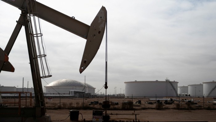 A pump jack operates near a crude oil reserve