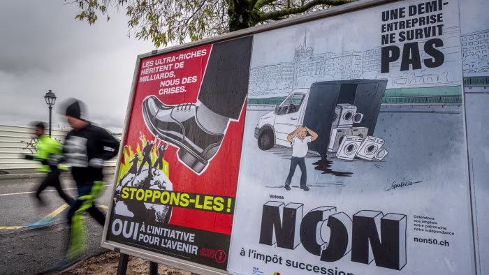 Two illustrated posters in Geneva show opposing views on taxing the super-rich: one advocates for the tax with a giant shoe stepping on people, while the other opposes it, depicting a distressed man beside a van with appliances.