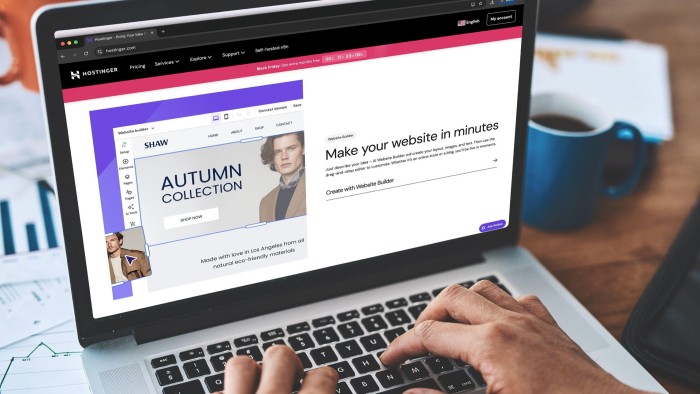 A person types on a laptop displaying a website builder interface.