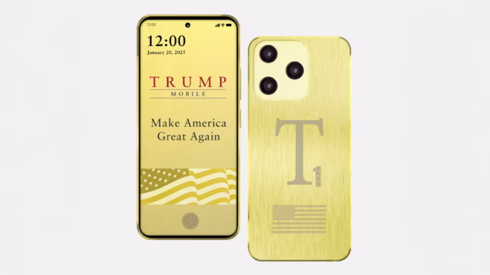 A gold-coloured smartphone with "Trump Mobile" and "Make America Great Again" displayed on the screen. The back features a large "T", an American flag and three camera lenses.